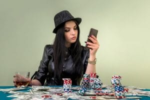 glamorous-girl-in-casino-with-mobile-phone